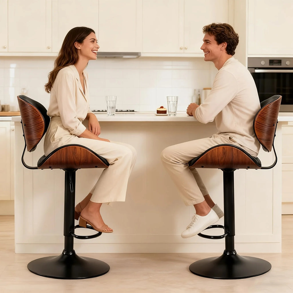 Modern Adjustable Ergonomic Bar Stool Set
Dine and drink in total comfort. These sleek PU leather bar stools feature an adjustable gas lift, ergonomic backrest, and footrest. Available in sets of 2 or 4 to perfectly fit your space.