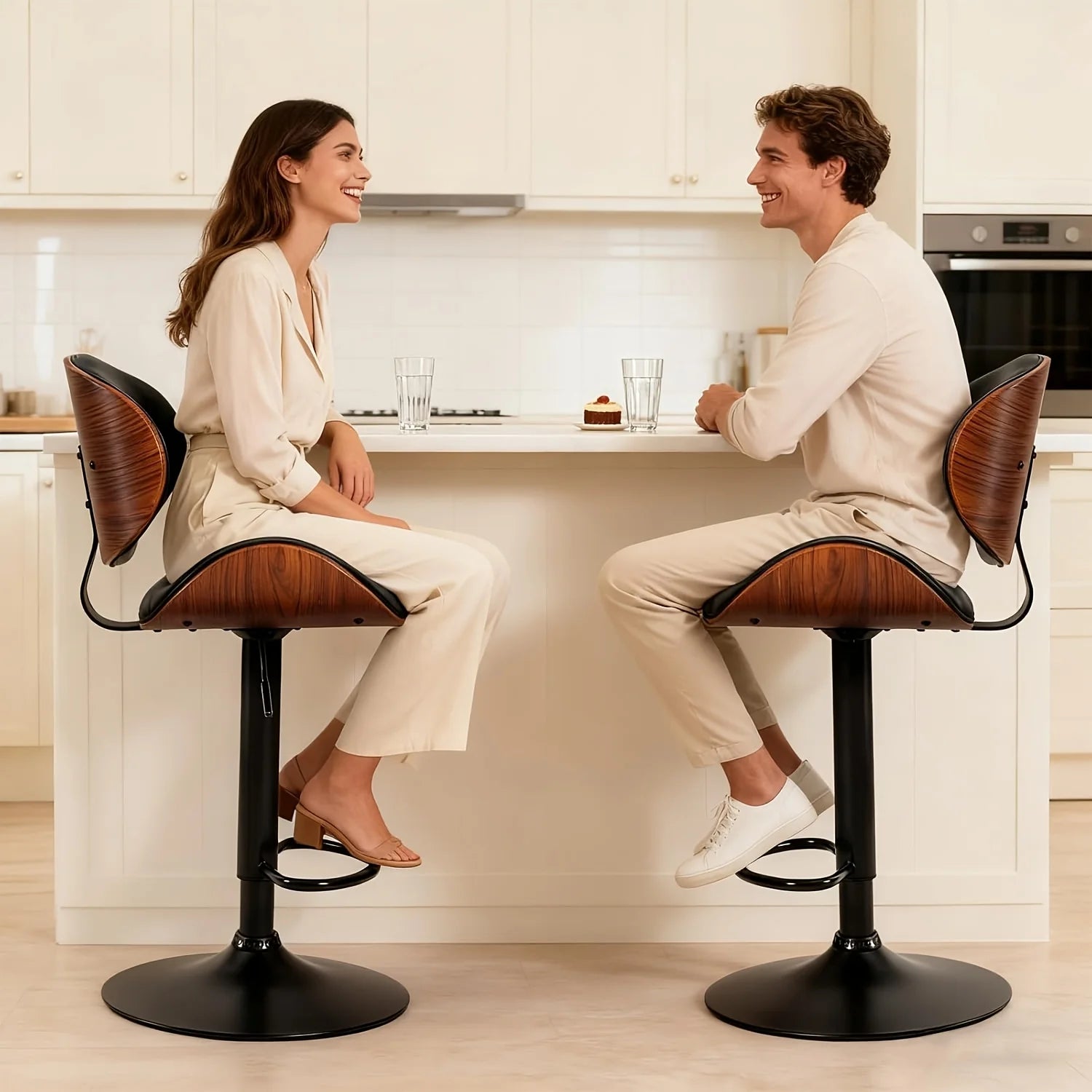 Modern Adjustable Ergonomic Bar Stool Set
Dine and drink in total comfort. These sleek PU leather bar stools feature an adjustable gas lift, ergonomic backrest, and footrest. Available in sets of 2 or 4 to perfectly fit your space.