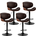 Modern Adjustable Ergonomic Bar Stool Set
Dine and drink in total comfort. These sleek PU leather bar stools feature an adjustable gas lift, ergonomic backrest, and footrest. Available in sets of 2 or 4 to perfectly fit your space.